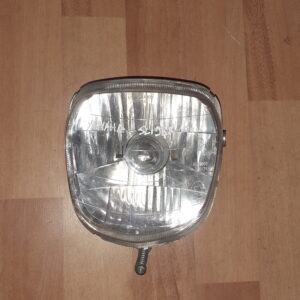 Faro delantero original para scooter Yamaha Slider 50 (1995-2002). Óptica delantera homologada verificada.
