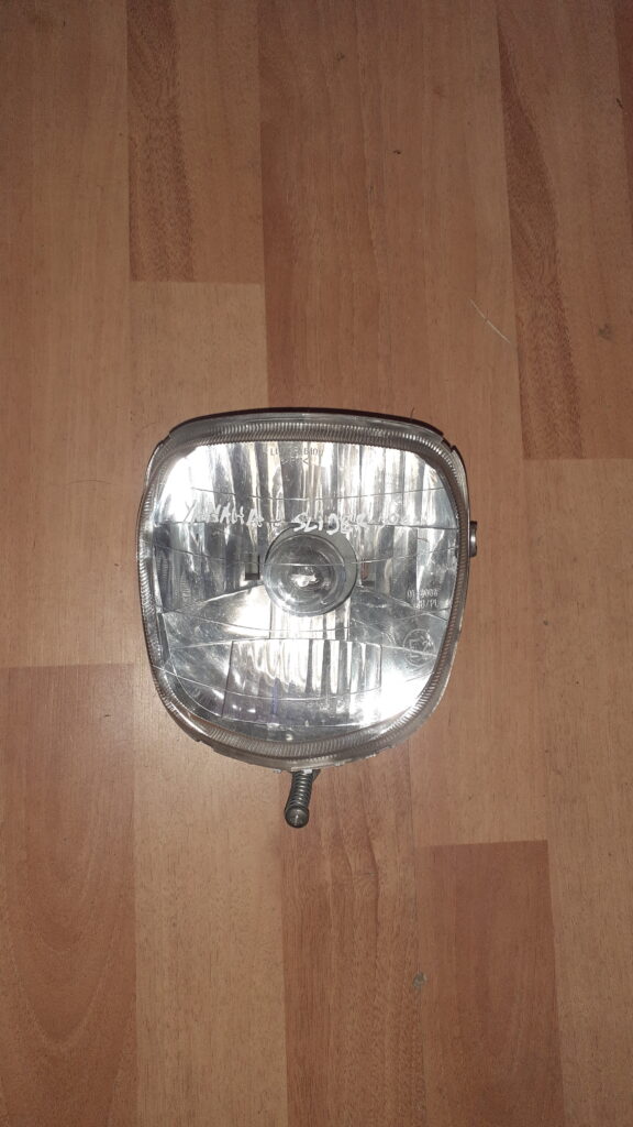 Faro delantero original para scooter Yamaha Slider 50 (1995-2002). Óptica delantera homologada verificada.